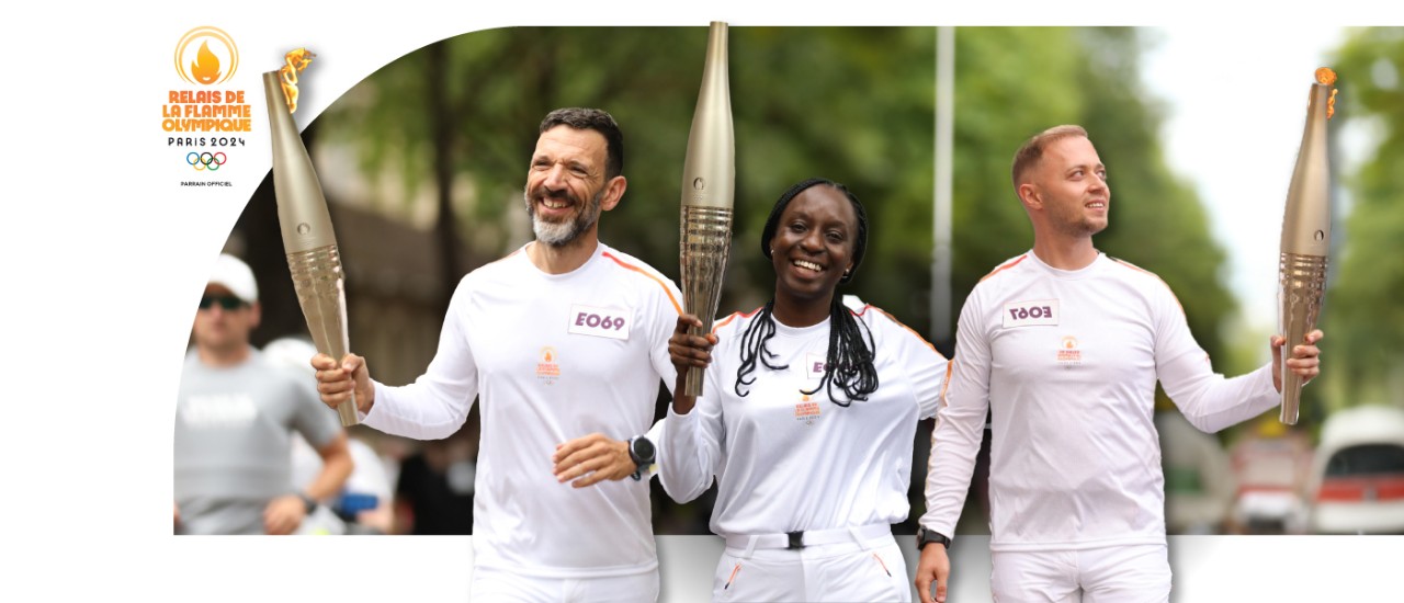 Coca-Cola HBC team members carry the flame at Paris 2024 Olympic Torch Relay